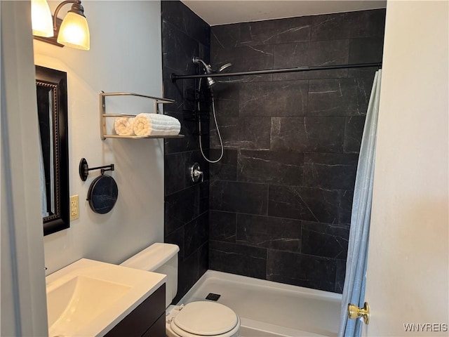 13 Wildflower, Ellicottville, NY 14731 - bathroom with tiled shower, vanity, and toilet