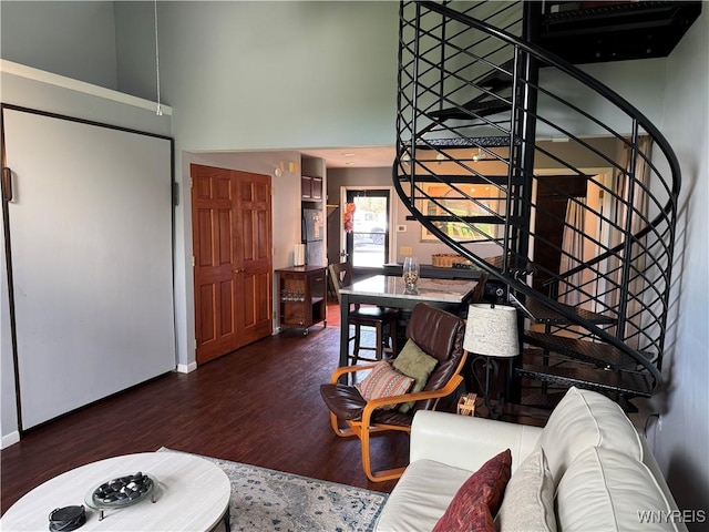 13 Wildflower, Ellicottville, NY 14731 - living room with baseboards, stairway, a towering ceiling, and wood finished floors