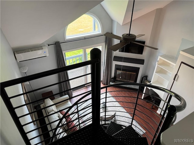 13 Wildflower, Ellicottville, NY 14731 - staircase featuring an AC wall unit, ceiling fan, and lofted ceiling