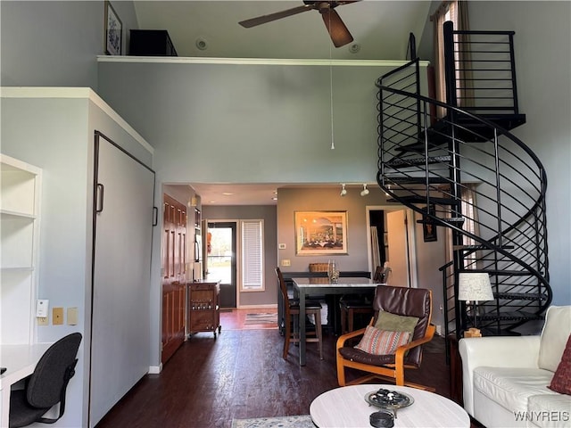 13 Wildflower, Ellicottville, NY 14731 - living room featuring a ceiling fan, wood finished floors, a towering ceiling, and stairs