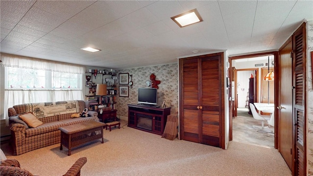 5 E Washington St, Bath, NY 14810 - living area with a baseboard radiator, carpet, and wallpapered walls