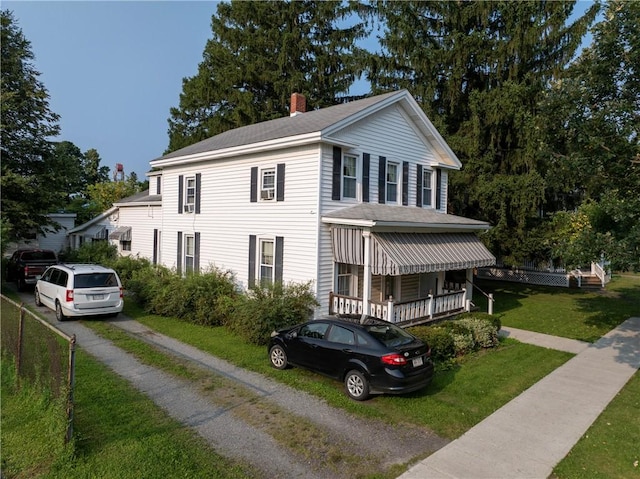 5 E Washington St, Bath, NY 14810 - view of front of property featuring roof with shingles, driveway, a chimney, and a front lawn