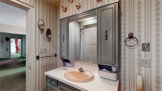 5 E Washington St, Bath, NY 14810 - bathroom featuring wallpapered walls and vanity
