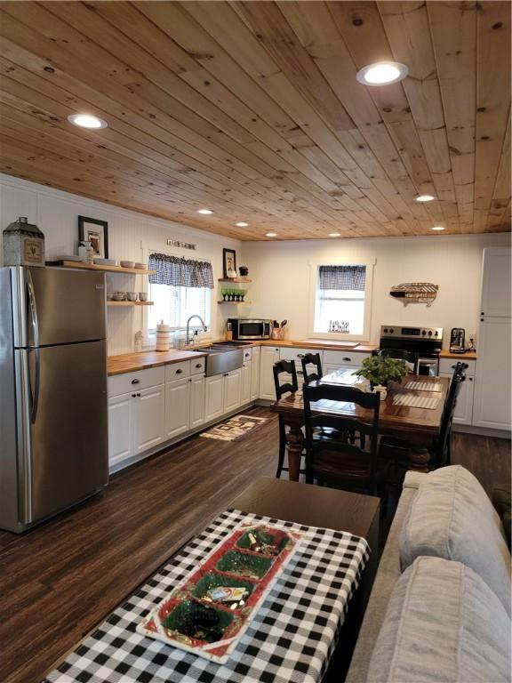 204 Ives Settlement Rd, Guilford, NY 13780 - interior space with a sink, open shelves, dark wood-type flooring, appliances with stainless steel finishes, and wooden ceiling