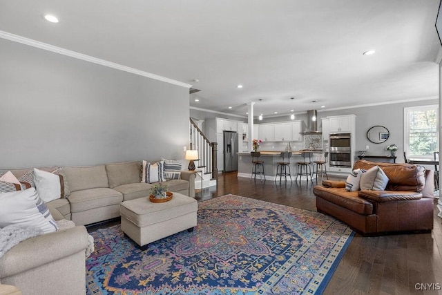 living area featuring dark wood-type flooring, crown molding, stairway, and recessed lighting