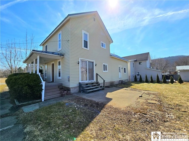 216 S Pleasant St, Shinglehouse, PA 16748 - view of front facade with a front yard and covered porch