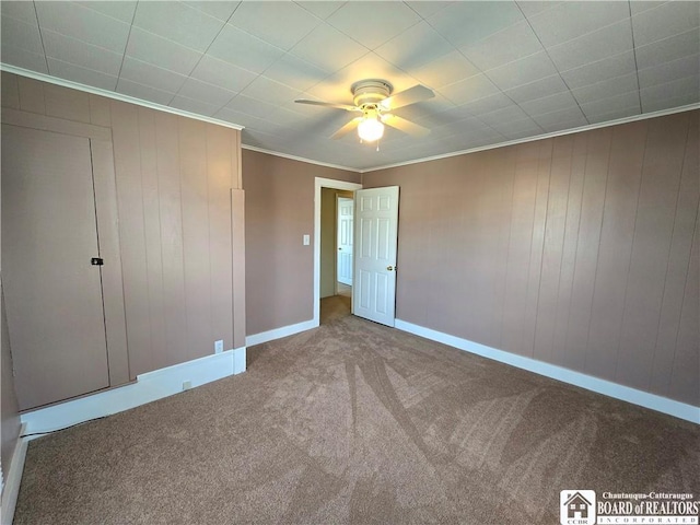 216 S Pleasant St, Shinglehouse, PA 16748 - unfurnished bedroom with crown molding, baseboards, a ceiling fan, and carpet