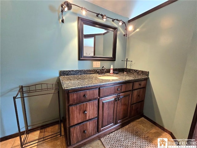 216 S Pleasant St, Shinglehouse, PA 16748 - bathroom with tile patterned floors, vanity, and baseboards
