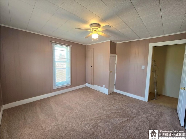 216 S Pleasant St, Shinglehouse, PA 16748 - unfurnished bedroom with ornamental molding, ceiling fan, carpet floors, and baseboards