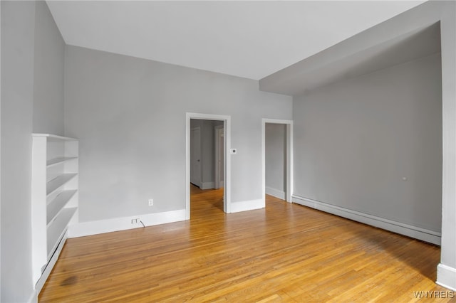 153 Allen St, Buffalo, NY 14201 - interior space featuring baseboard heating, light wood-type flooring, and baseboards