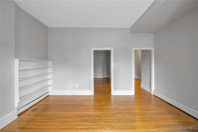 153 Allen St, Buffalo, NY 14201 - interior space with light wood finished floors, baseboard heating, and baseboards