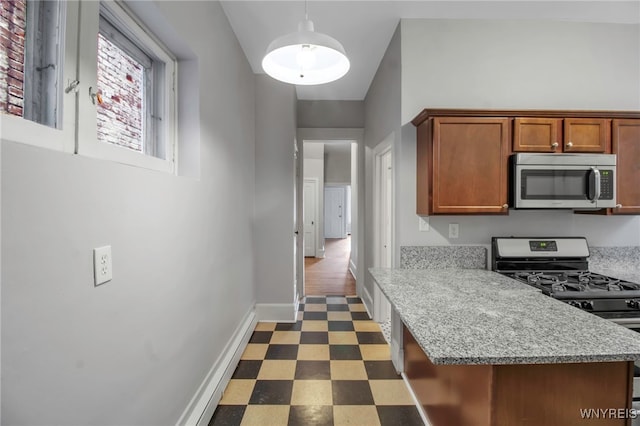 153 Allen St, Buffalo, NY 14201 - kitchen featuring baseboards, tile patterned floors, brown cabinetry, appliances with stainless steel finishes, and hanging light fixtures