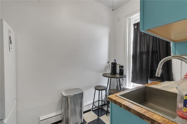 153 Allen St, Buffalo, NY 14201 - dining area featuring tile patterned floors and baseboards