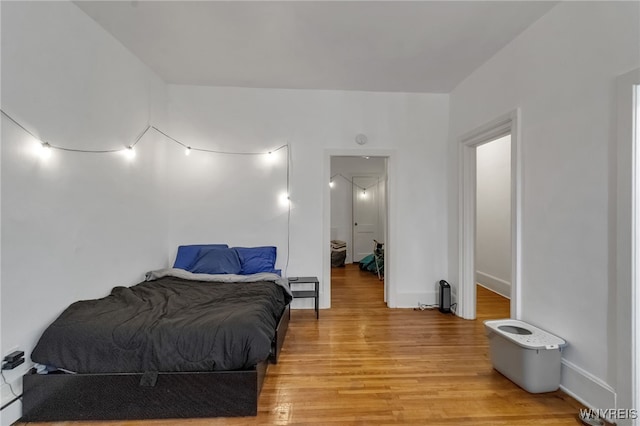 153 Allen St, Buffalo, NY 14201 - bedroom featuring baseboards and light wood-type flooring