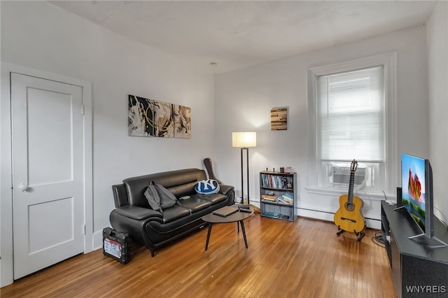 153 Allen St, Buffalo, NY 14201 - living room featuring cooling unit, a baseboard heating unit, and wood finished floors