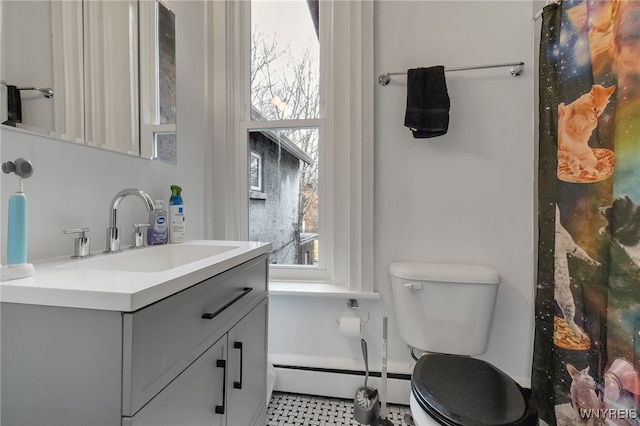 153 Allen St, Buffalo, NY 14201 - bathroom with toilet, a baseboard radiator, and vanity
