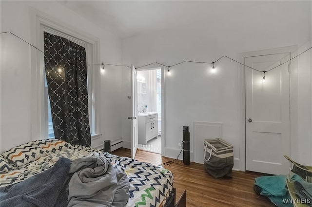 153 Allen St, Buffalo, NY 14201 - bedroom with baseboard heating and wood finished floors