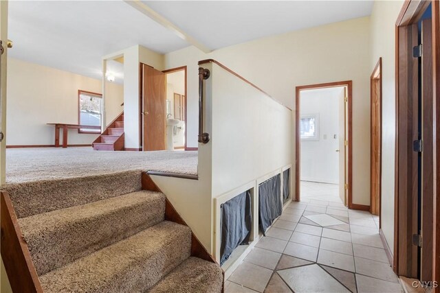 staircase with tile patterned floors