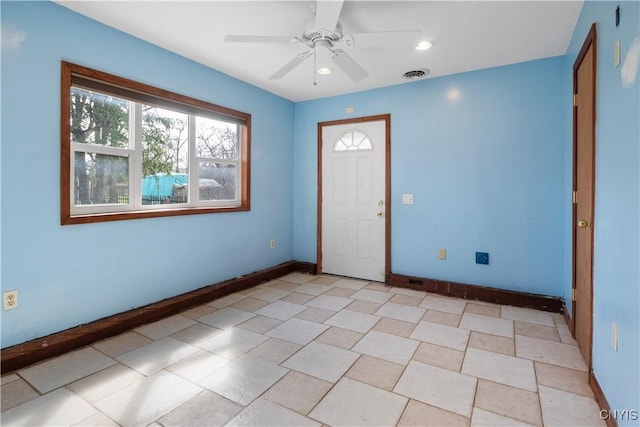 interior space featuring recessed lighting, visible vents, baseboards, and a ceiling fan