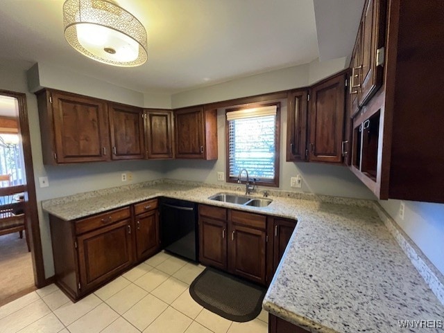 kitchen featuring dark brown cabinets, light tile patterned flooring, a sink, and dishwasher