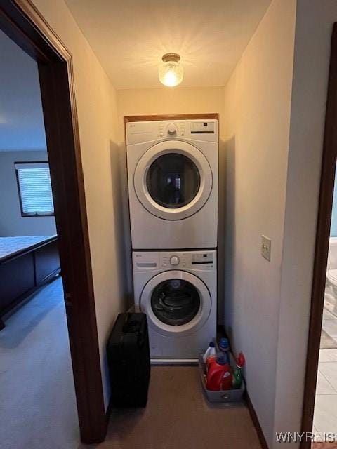 laundry room with stacked washer and clothes dryer
