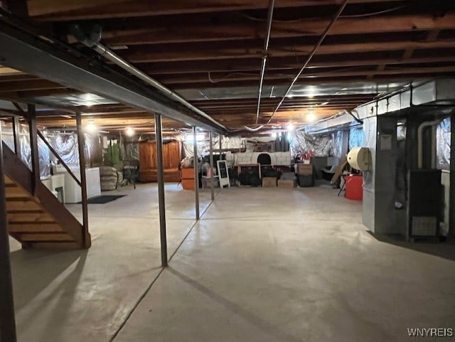 unfinished basement with stairs