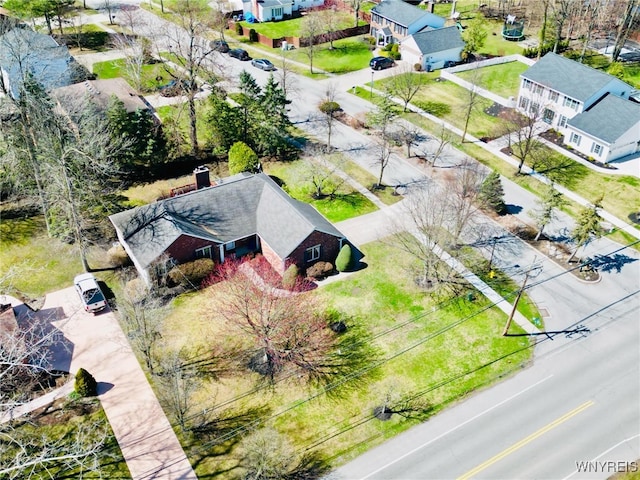 birds eye view of property with a residential view