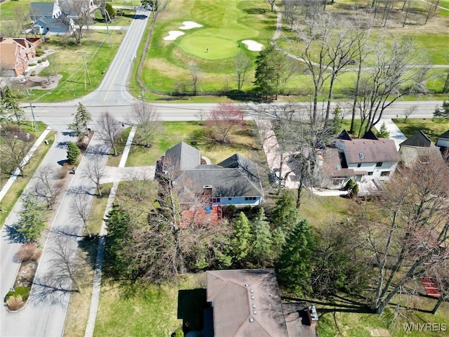 birds eye view of property featuring view of golf course and a residential view