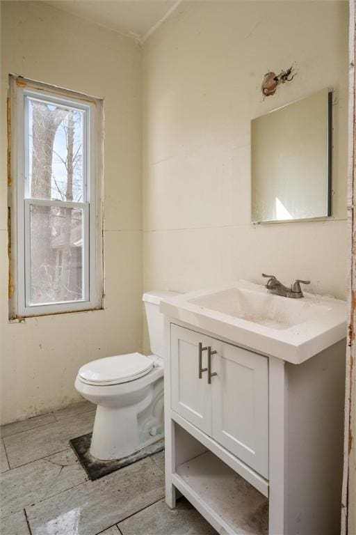 half bath with vanity and toilet
