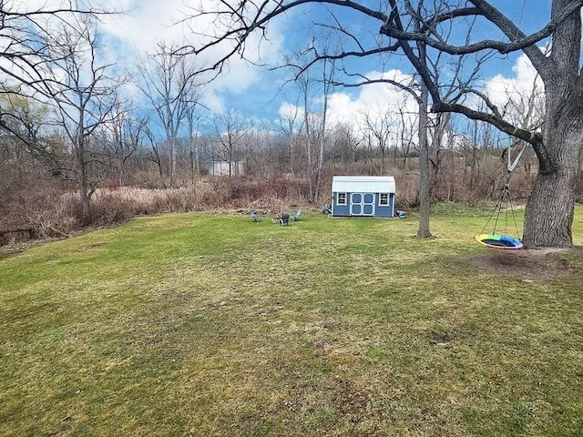 view of yard with an outdoor structure and a storage unit