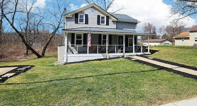 view of front of property featuring a front yard and a porch