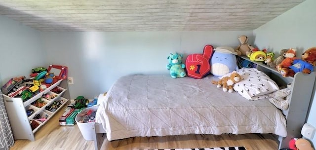 bedroom with wood finished floors