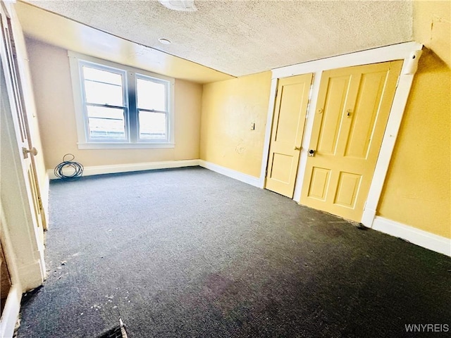 99 Roebling Ave, Buffalo, NY 14215 - carpeted spare room featuring baseboards and a textured ceiling