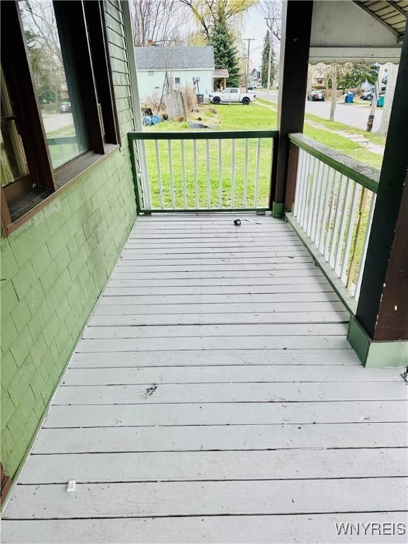99 Roebling Ave, Buffalo, NY 14215 - wooden terrace with covered porch and a lawn