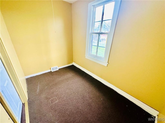 99 Roebling Ave, Buffalo, NY 14215 - empty room with dark colored carpet, visible vents, and baseboards