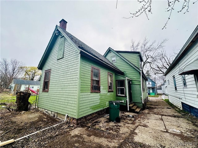 99 Roebling Ave, Buffalo, NY 14215 - view of side of home featuring a chimney