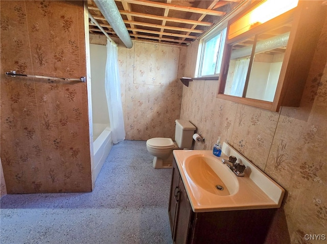 full bath with toilet, vanity, and shower / tub combo with curtain