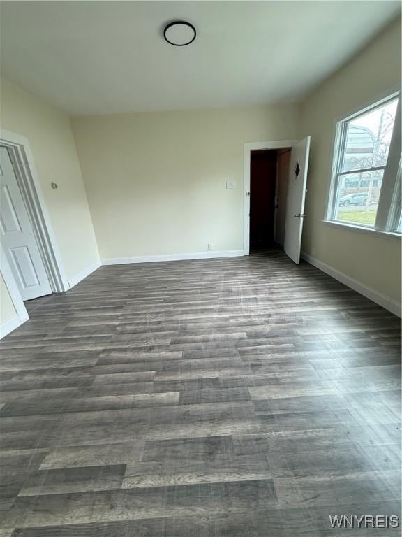 72 Person St, Buffalo, NY 14212 - spare room with dark wood-style floors and baseboards