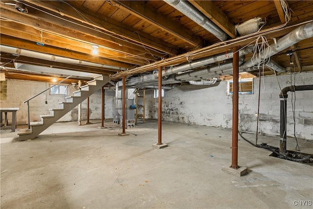 below grade area with stairway and heating unit