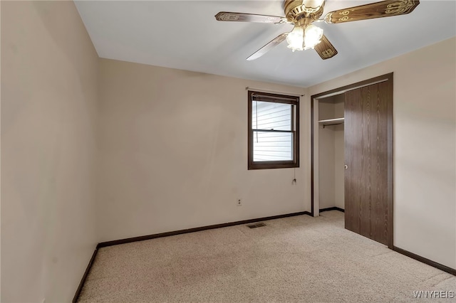 unfurnished bedroom with visible vents, baseboards, carpet flooring, and a closet