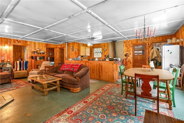 172 Green St, Ephratah, NY 13452 - living area with wooden walls and finished concrete flooring