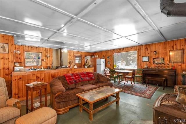172 Green St, Ephratah, NY 13452 - living room featuring concrete flooring and wooden walls