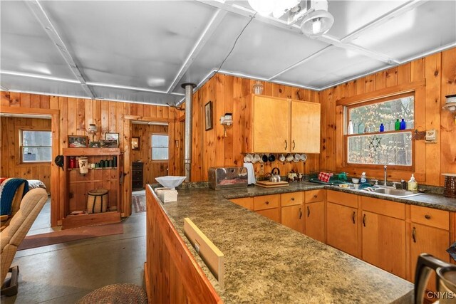 172 Green St, Ephratah, NY 13452 - kitchen with brown cabinetry, wooden walls, and a sink