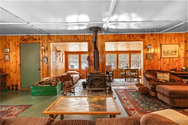 172 Green St, Ephratah, NY 13452 - living area featuring a wood stove and wooden walls