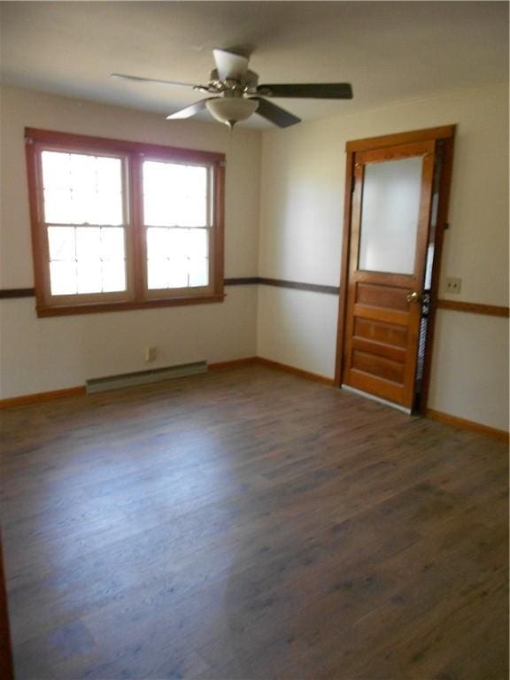 613 Hatfield St, Horseheads, NY 14845 - spare room featuring a baseboard radiator, wood finished floors, and baseboards