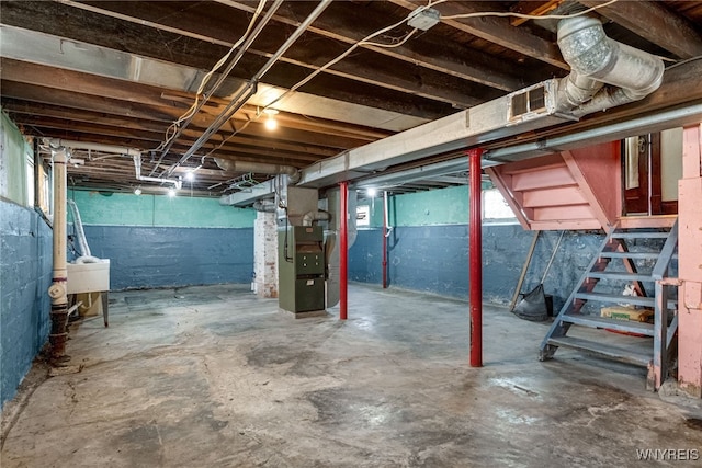 43 Freund St, Buffalo, NY 14211 - below grade area featuring a sink, visible vents, stairway, and heating unit