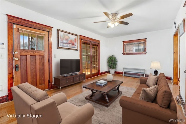 43 Freund St, Buffalo, NY 14211 - living room featuring ceiling fan, wood finished floors, and baseboards
