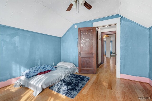 43 Freund St, Buffalo, NY 14211 - bedroom featuring lofted ceiling, baseboards, a ceiling fan, and wood finished floors