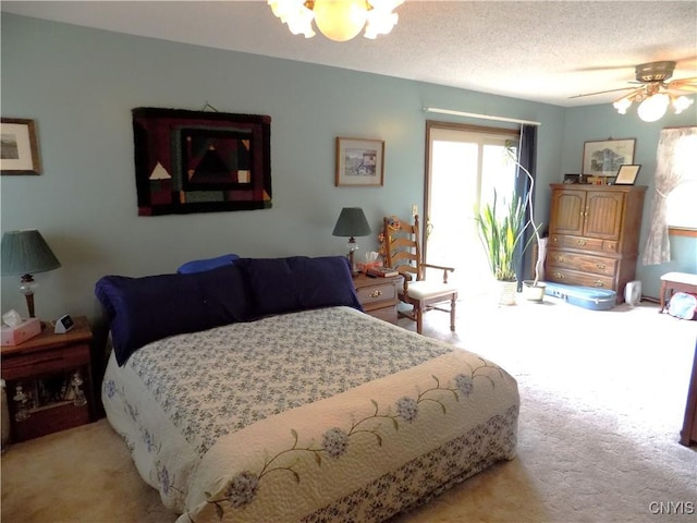 bedroom featuring a ceiling fan and light colored carpet