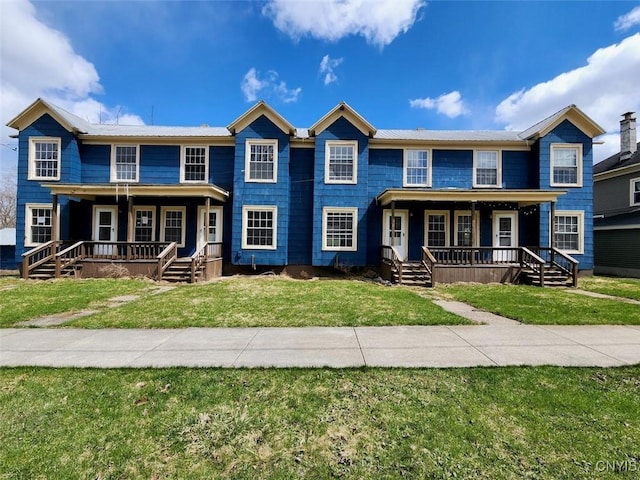 view of front facade with a porch and a front lawn